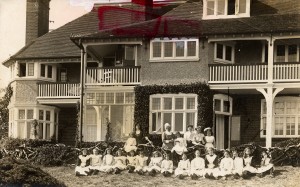 Photograph of matron, staff and children outside 'Coronation Cottage', St David's Home, Broadstairs, Kent, c1912