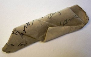 Crumpled document removed from envelope