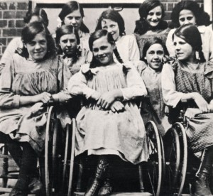 Girls at St. Nicholas’ Hospital and Special School, Pyrford, Surrey. Three are in wheelchairs. [1915]