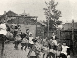 Girls from St Monica's sitting on a see-saw, 1897