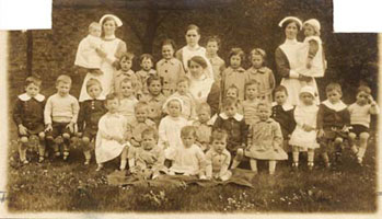 Smaller children, like these ones here, were allowed to wear informal and casual clothing more often than the older children, who were encouraged to wear more uniformed dress.