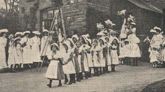 fetes were always a very popular event. The Homes could not only sell home-made items to help raise funds but also show off any entertainment they had been practising. These girls from St Michael's are performing a traditional English country dance.