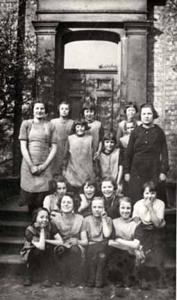 Girls and staff at the front of the home