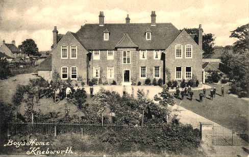 A postcard showing the front and surrounding grounds of the new Home