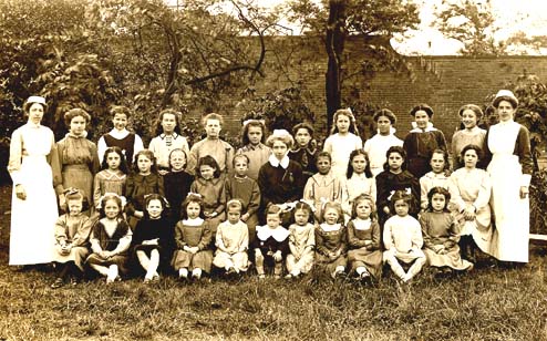 A group photograph of staff and girls