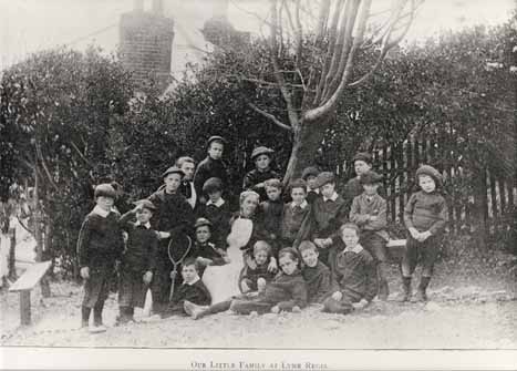 Informal photograph of the Matron and boys of St Michael's Home for Boys, Lyme Regis