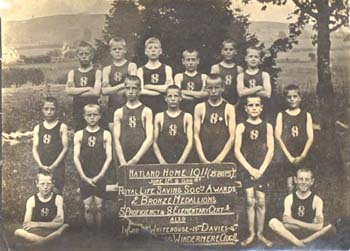 The Natland Home swimming team were highly regarded in the Society. They even visited other homes to give swimming displays to the children. Here they are shown with a plaque they received from the Royal Life Saving Society in 1911. 