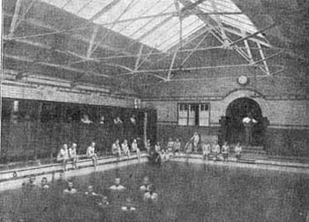 The boys from the Leicester Home enjoy the luxury of an indoor pool. The Society believed that swimming lessons gave the children important life-saving skills, as well as keeping them fit and healthy. 