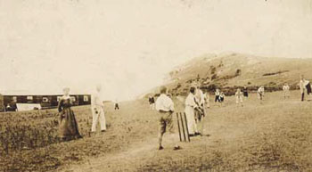The Welsh hills around Dyserth provide the scenery for this game of cricket. The children were on their summer holiday from the Sycamore Home in Moseley, Staffordshire.