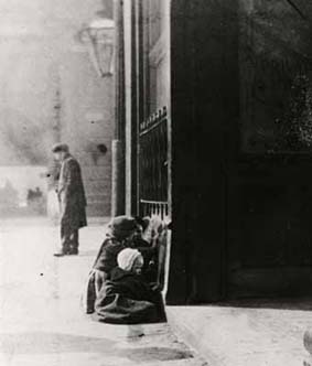 Huddled in doorways or outside shops, homeless children were a visible part of London life.
