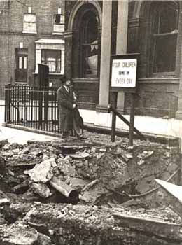 The Second World War disrupted much of the Waifs and Strays' Society's work. Many homes were evacuated to the countryside, and war nurseries were established around the country to house the babies. This photograph shows one instance of how the Society was directly affected by the conflict.