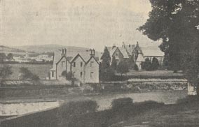 View across a river of the Brecon Home