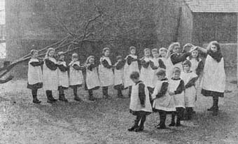 Girls playing oranges and lemons