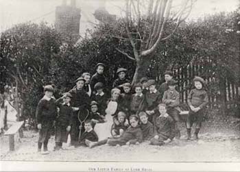 In this informal photograph two boys are pictured with tennis rackets. The Society encouraged exercise through play, with sports like tennis.