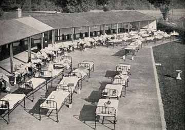 Children with serious illnesses were sent to the Society's hospital homes, where they could receive close medical attention. This outdoor ward of St Martin's Home was built to bring fresh air and sunshine to tuberculosis sufferers. In 1923 St Martin's Home was amalgamated with St Nicholas' Home, which was also in Pyrford.